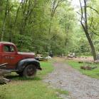 072 - Old pickup with beehives behind